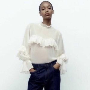 Sheer blouse with ruffles